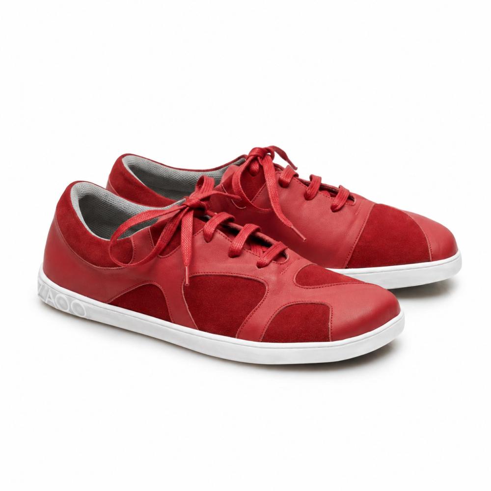 De QAANAAQ Bordeaux-sneakers van ZAQQ zijn gemaakt van nappaleer en suède en hebben een witte zero-drop rubberen zool en bijpassende rode veters.